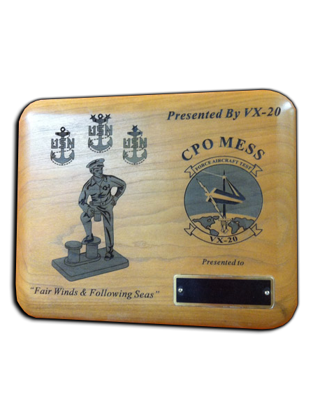 Engraved wood plaque with Navy insignia and a sailor figure